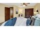 Relaxing bedroom features a comfortable bed, side table, and closet doors at 1629 N K St, Elwood, IN 46036