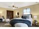 Comfortable bedroom with a ceiling fan, cozy blankets, and ample natural light at 1629 N K St, Elwood, IN 46036