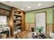Open dining area featuring a small table, shelving unit, and neutral decor at 1629 N K St, Elwood, IN 46036