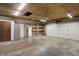 Spacious garage with overhead lighting and functional garage door opener at 1629 N K St, Elwood, IN 46036