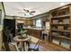 Functional kitchen features wood cabinets, appliances, and a cozy dining area at 1629 N K St, Elwood, IN 46036