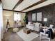 Cozy living room with decorative wood paneling, beamed ceilings, and comfortable seating at 1629 N K St, Elwood, IN 46036