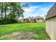 Lush backyard with a well-kept lawn, shed, and charming single-Gathering home at 1697 Stacy Lynn Dr, Indianapolis, IN 46231