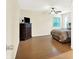 Spacious bedroom with hardwood floors, ceiling fan, and dresser at 1697 Stacy Lynn Dr, Indianapolis, IN 46231