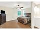 Cozy bedroom with hardwood floors, ceiling fan, and ensuite bathroom at 1697 Stacy Lynn Dr, Indianapolis, IN 46231