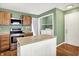 Kitchen with butcher block island, stainless steel appliances, and adjacent laundry area at 1697 Stacy Lynn Dr, Indianapolis, IN 46231