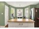Well lit kitchen area with green walls, a butcher block island, and stainless steel refrigerator at 1697 Stacy Lynn Dr, Indianapolis, IN 46231