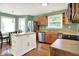 Well-equipped kitchen with a central island, stainless steel appliances, and wood cabinetry at 1697 Stacy Lynn Dr, Indianapolis, IN 46231