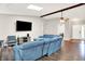 Relaxing living room with a large sectional sofa, mounted TV, and hardwood floors at 1697 Stacy Lynn Dr, Indianapolis, IN 46231