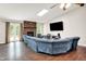 Spacious living room features a large sectional sofa, fireplace, skylight and French doors to the backyard at 1697 Stacy Lynn Dr, Indianapolis, IN 46231