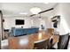 Open concept living area featuring natural light, a sectional sofa, and dining space at 1697 Stacy Lynn Dr, Indianapolis, IN 46231