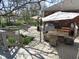 Enjoy outdoor living on the spacious deck with multiple seating areas, a grill, and charming garden accents at 1737 Friendship Dr, Indianapolis, IN 46217