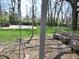 Relax and enjoy the backyard featuring a brick patio, swing, and comfortable seating amongst the mature trees at 1737 Friendship Dr, Indianapolis, IN 46217