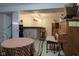 Finished basement features a wet bar, piano, and dining table creating a great additional living and entertaining space at 1737 Friendship Dr, Indianapolis, IN 46217