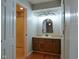 Bathroom with a wood vanity and a shower/tub combo at 1737 Friendship Dr, Indianapolis, IN 46217