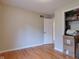 An empty bedroom with wood floors, neutral walls, and a closet at 1737 Friendship Dr, Indianapolis, IN 46217