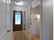 Bright foyer featuring a patterned front door and classic white trim at 1737 Friendship Dr, Indianapolis, IN 46217