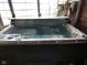Relax in this indoor hot tub complete with multicolor lights and controls perfect for unwinding and entertaining guests at 1737 Friendship Dr, Indianapolis, IN 46217