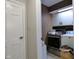 Practical laundry room with modern appliances, tile flooring, and ample storage for convenience at 1737 Friendship Dr, Indianapolis, IN 46217
