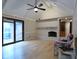 Bright living room with a white brick fireplace, vaulted ceilings, and hardwood floors, offering a cozy atmosphere at 1737 Friendship Dr, Indianapolis, IN 46217