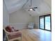 Bright living room with vaulted ceilings, light wood floors, and access to a deck, creating an inviting space at 1737 Friendship Dr, Indianapolis, IN 46217