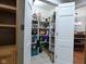 Walk-in pantry with ample shelving for organized storage at 1737 Friendship Dr, Indianapolis, IN 46217