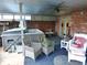 Enclosed patio with hot tub, ceiling fan, and comfortable seating perfect for relaxation and outdoor entertainment at 1737 Friendship Dr, Indianapolis, IN 46217