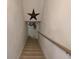 Stairs leading to the basement with a handrail at 1737 Friendship Dr, Indianapolis, IN 46217