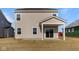 View of the back of the house with sliding glass door and covered back patio at 2252 Marjorie Way, Shelbyville, IN 46176