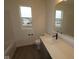 Modern bathroom featuring a stylish vanity, sleek fixtures, and a window for natural light at 2252 Marjorie Way, Shelbyville, IN 46176