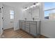 This bathroom has a double sink vanity and a large mirror with plenty of light at 2252 Marjorie Way, Shelbyville, IN 46176