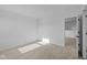 Light-filled bedroom featuring neutral carpet and an open doorway at 2252 Marjorie Way, Shelbyville, IN 46176