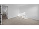Bright bedroom with neutral carpet and open doorway to additional living space at 2252 Marjorie Way, Shelbyville, IN 46176