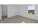 Bedroom with closet, neutral carpet and large window overlooking greenery at 2252 Marjorie Way, Shelbyville, IN 46176