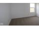 Bright bedroom features neutral carpeting and a window offering natural light at 2252 Marjorie Way, Shelbyville, IN 46176