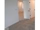 Hallway featuring neutral carpet, white walls, white trim, and modern doors at 2252 Marjorie Way, Shelbyville, IN 46176