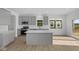 Modern kitchen with a large island, stainless steel appliances, and ample cabinet space at 2252 Marjorie Way, Shelbyville, IN 46176