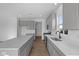 Bright kitchen with stainless steel appliances, quartz countertops, and a central island at 2252 Marjorie Way, Shelbyville, IN 46176