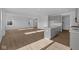 Open-concept living area featuring luxury vinyl plank flooring and a stylish kitchen island at 2252 Marjorie Way, Shelbyville, IN 46176