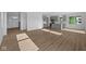Inviting living space connecting to a modern kitchen with luxury vinyl plank flooring at 2252 Marjorie Way, Shelbyville, IN 46176