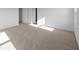 A bright bedroom with neutral carpet and white walls features natural light at 2268 Marjorie Way, Shelbyville, IN 46176