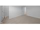 An open bedroom features neutral carpet, white walls, and natural lighting throughout at 2268 Marjorie Way, Shelbyville, IN 46176