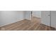 Bright bedroom featuring wood-look flooring, white trim, and a neutral color palette at 2268 Marjorie Way, Shelbyville, IN 46176