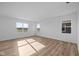 Large, airy bedroom with wood-look floors and an abundance of natural light from multiple windows at 2268 Marjorie Way, Shelbyville, IN 46176