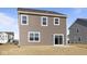 Two-story home with brown siding, sliding glass doors, and ample windows at 2268 Marjorie Way, Shelbyville, IN 46176