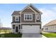 Charming two-story home featuring a two-car garage, neat landscaping, and a classic design at 2268 Marjorie Way, Shelbyville, IN 46176