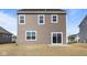 Exterior view of a two-story home with a sliding glass door and many windows at 2268 Marjorie Way, Shelbyville, IN 46176