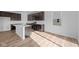 Bright kitchen features modern appliances, an island with a sink, and plenty of counter space at 2268 Marjorie Way, Shelbyville, IN 46176