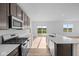 Gourmet kitchen boasts stainless steel appliances, gas range, an island, and plenty of cabinet space at 2268 Marjorie Way, Shelbyville, IN 46176