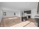 Bright, open-concept view of the living room shows plank flooring and natural light at 2268 Marjorie Way, Shelbyville, IN 46176